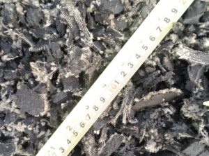 Ruler positioned above pieces of rubber