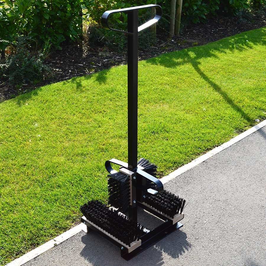 Outdoor boot wiper and scraper station by grass verge