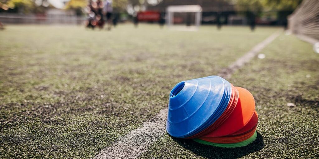 Training Session Must-Haves For Your Football Team Sports marker cone on a football field