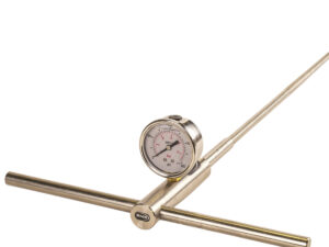 A pressure gauge mounted on a metal rod, set against a white background, used for soil testing with a penetrometer